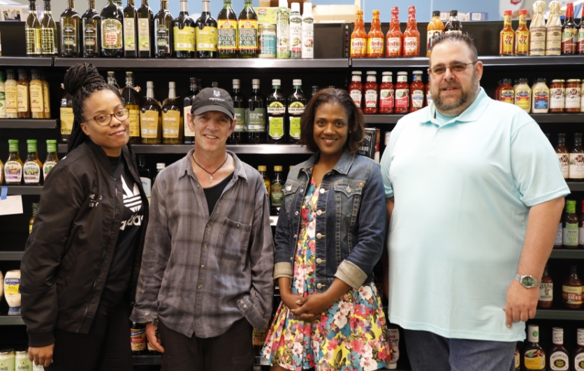 Urban Greens employees are waiting to welcome the community into the new retail grocery store.