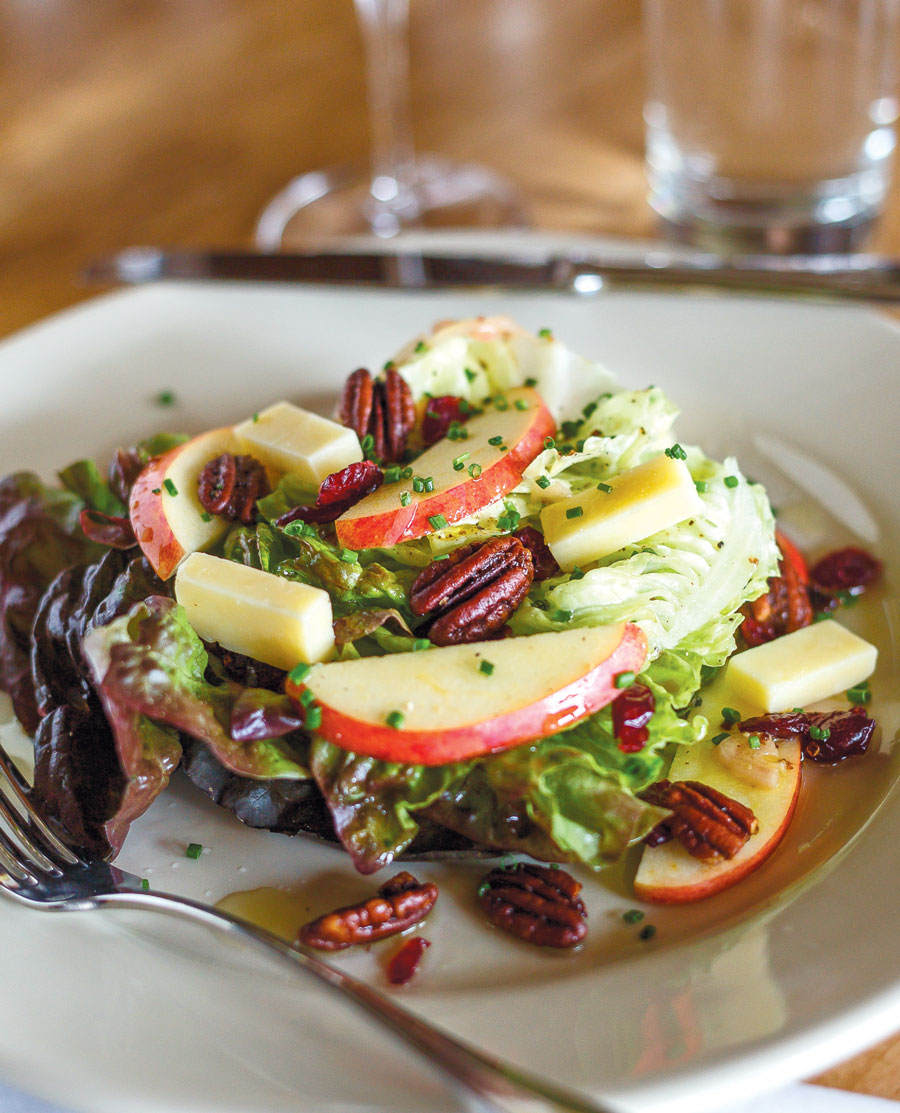 Boston Bibb salad made with spiced pecans and a vinaigrette with fresh apple cider
