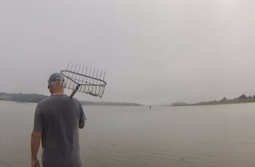 Mark Bullinger with said trusty rake, guiding me through the pond on foot.