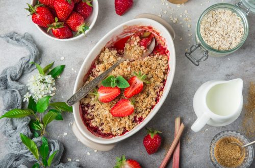 healthy vegan rhubarb and strawberry  oats crumble pie for breakfast, top view
